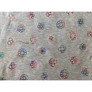 Melange gr med sm broderede blomster